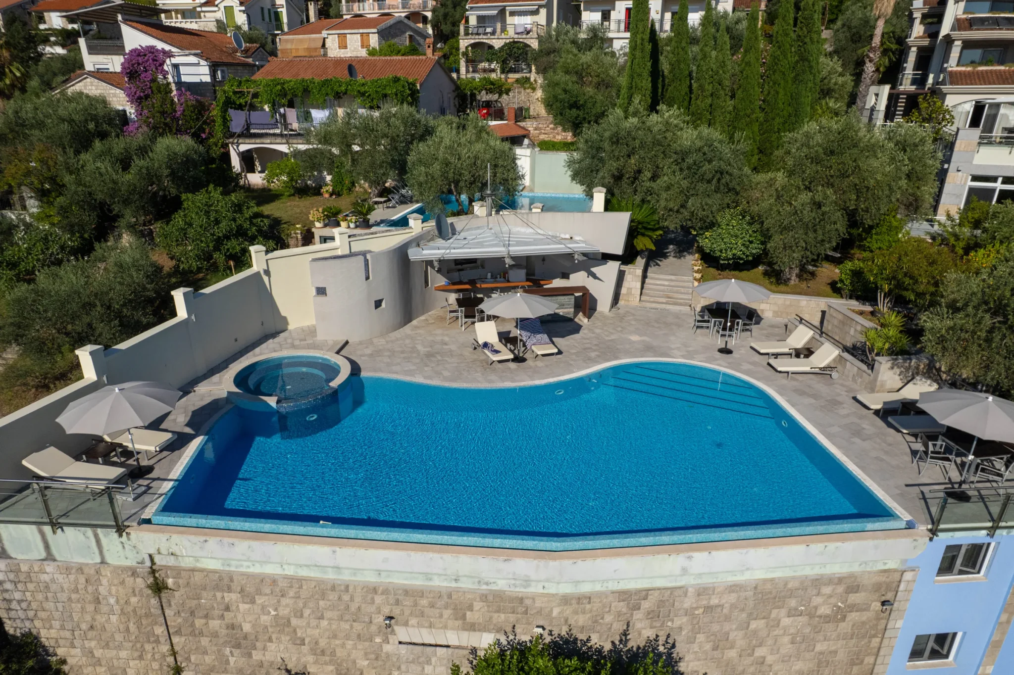 Infinity pool at Villa Antares surrounded by Mediterranean gardens