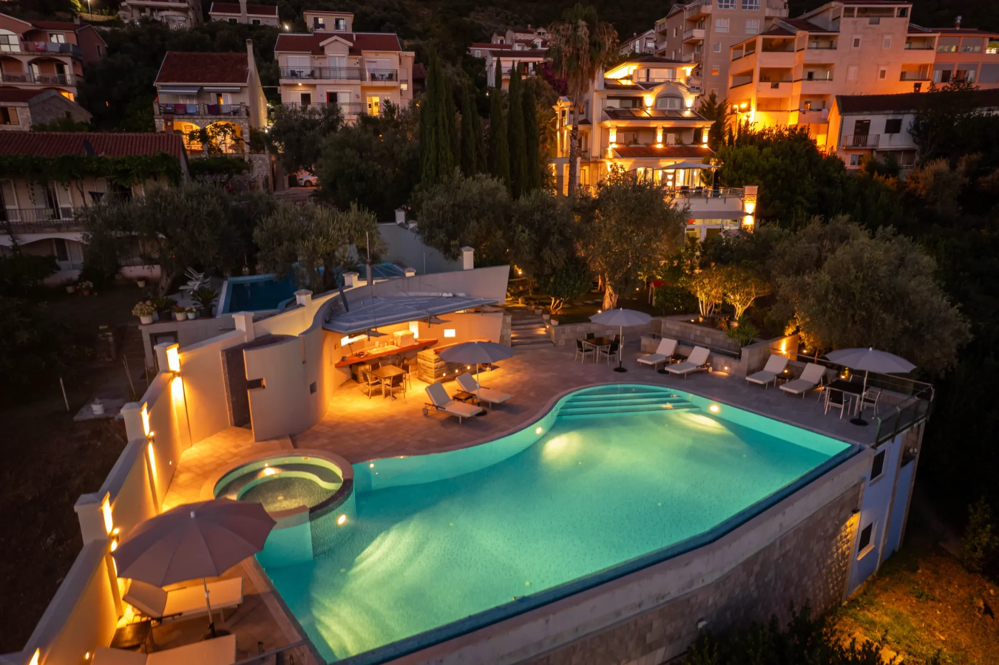 Villa Antares pool and terraces illuminated at dusk